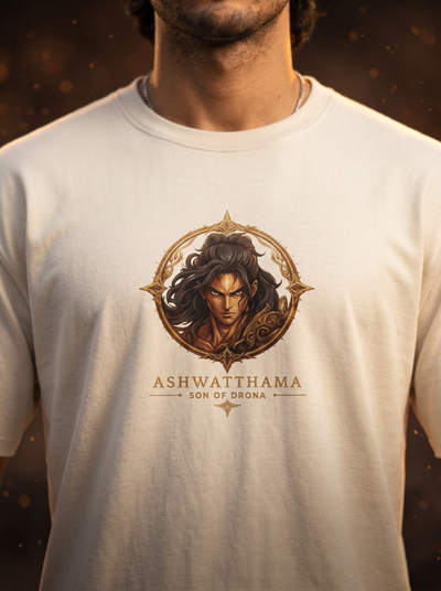 A close-up of a man wearing a white crewneck t-shirt with a graphic print of a fantasy character and the text 'ASHWATTHAMA SON OF DRONA' on the chest.